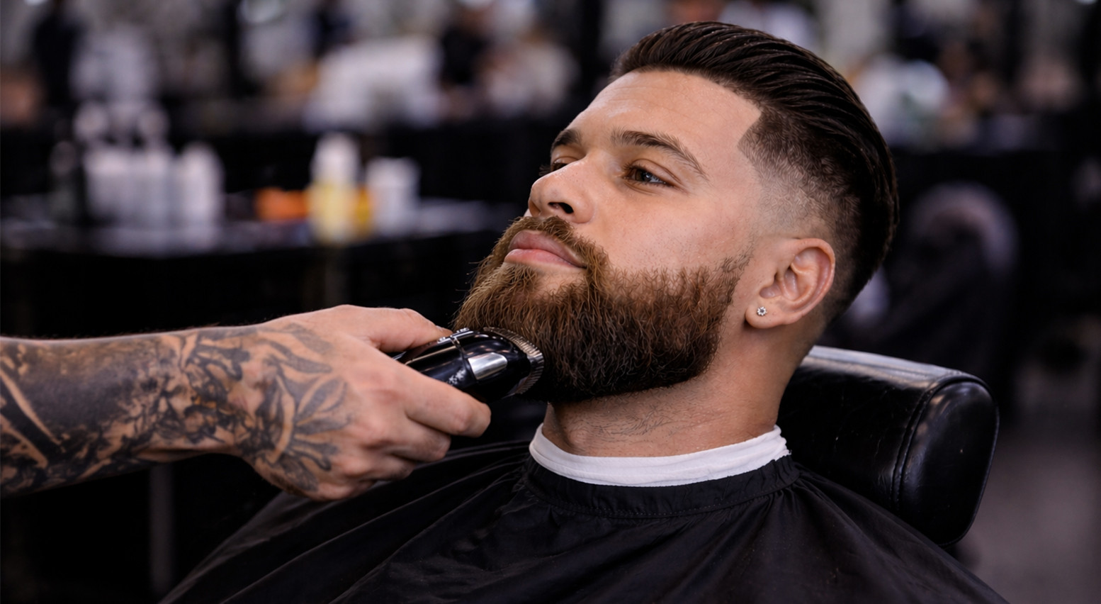 Barber trimming and lining up a client's beard