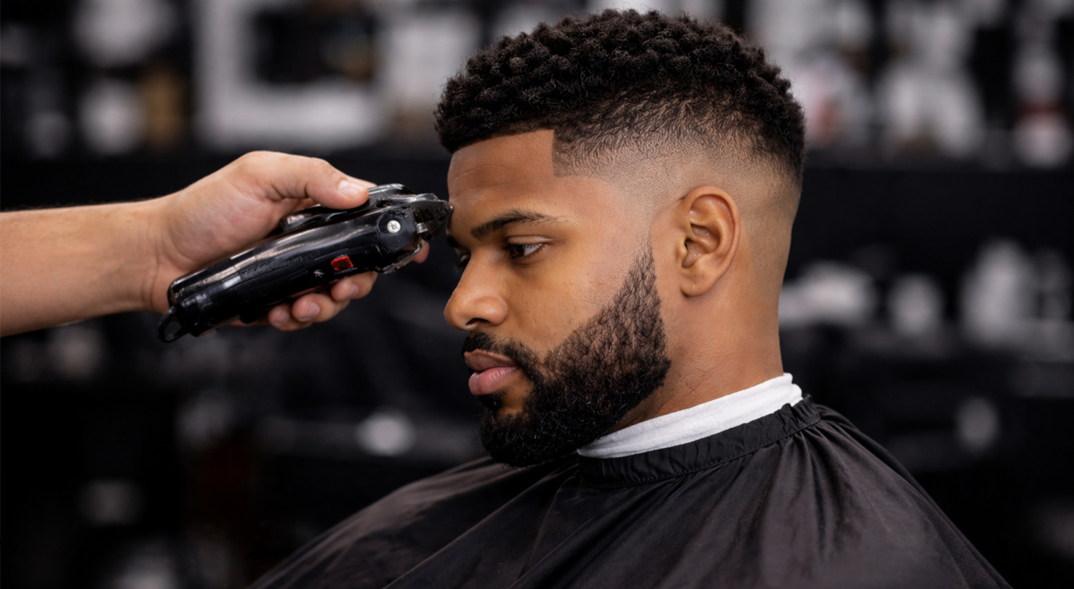 Skin fade and taper haircut with a sharp lineup