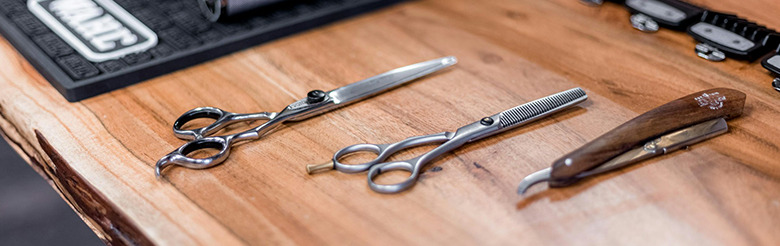 Barber shears on a wooden counter